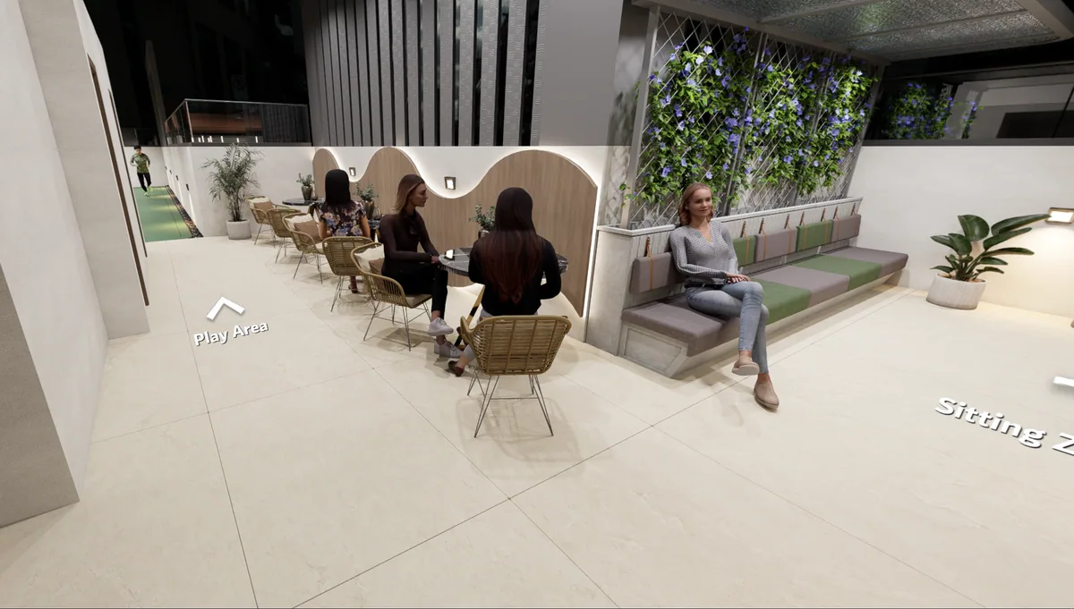 Landscaped terrace seating zone with cafe tables and a flowering green wall